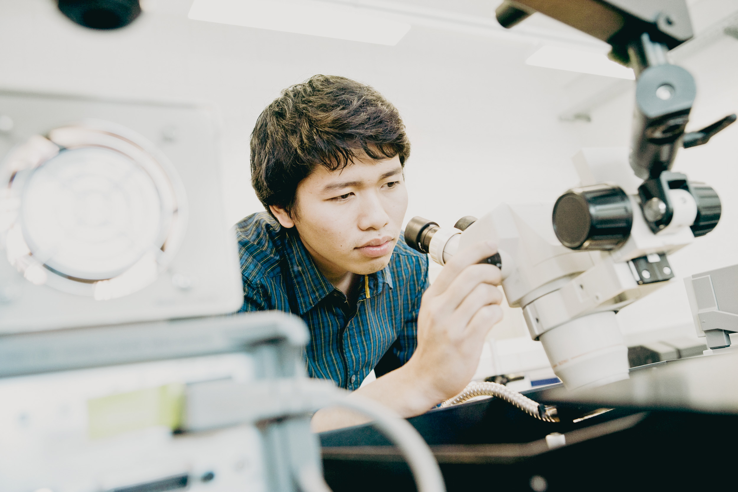 Student with a microscope